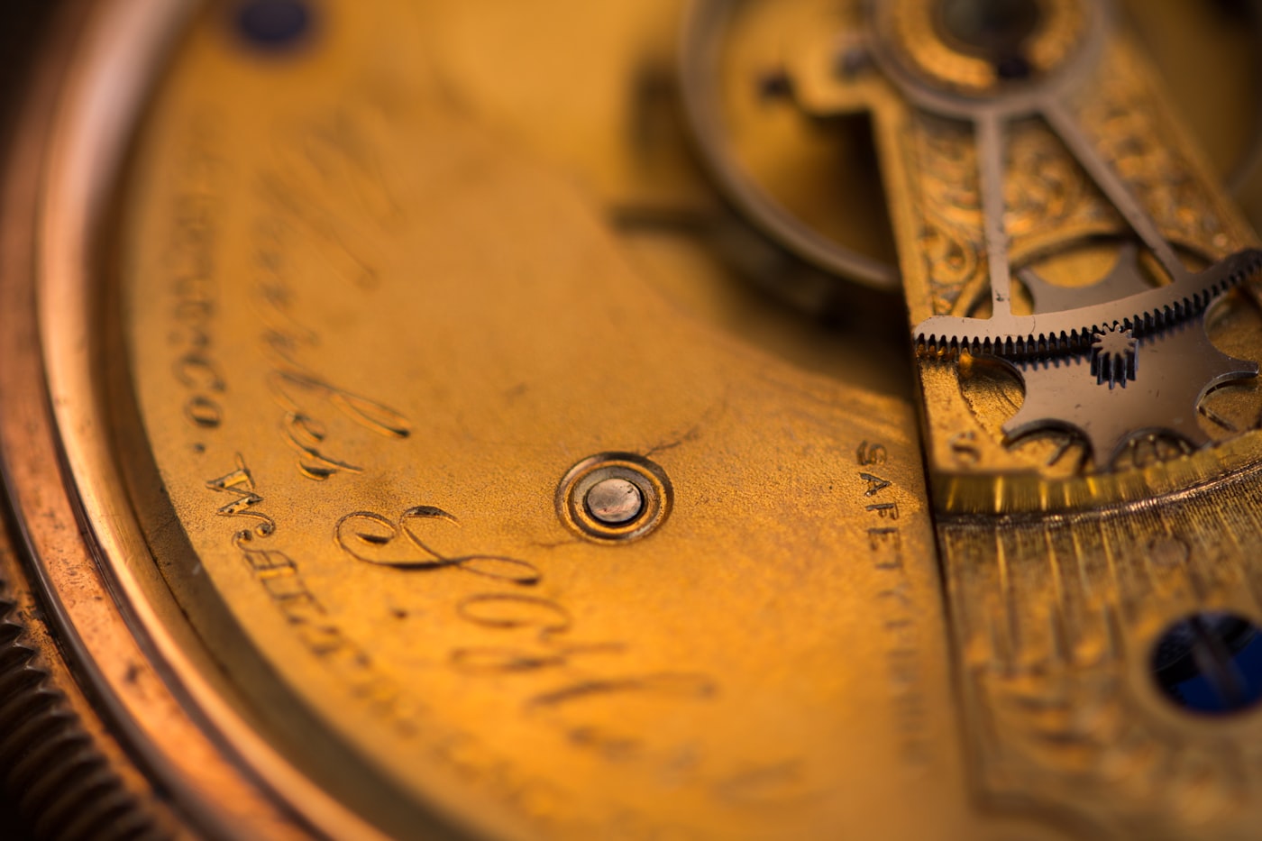 Antique pocket watch on dark surface